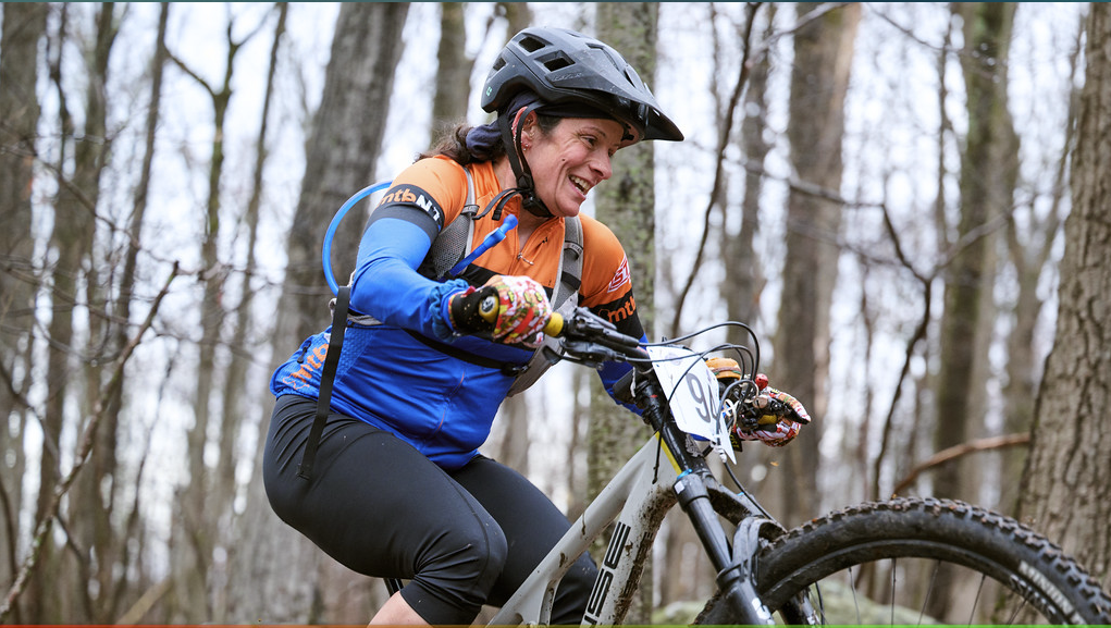 Smiling rider on the Jungle Escape mountain bike course
