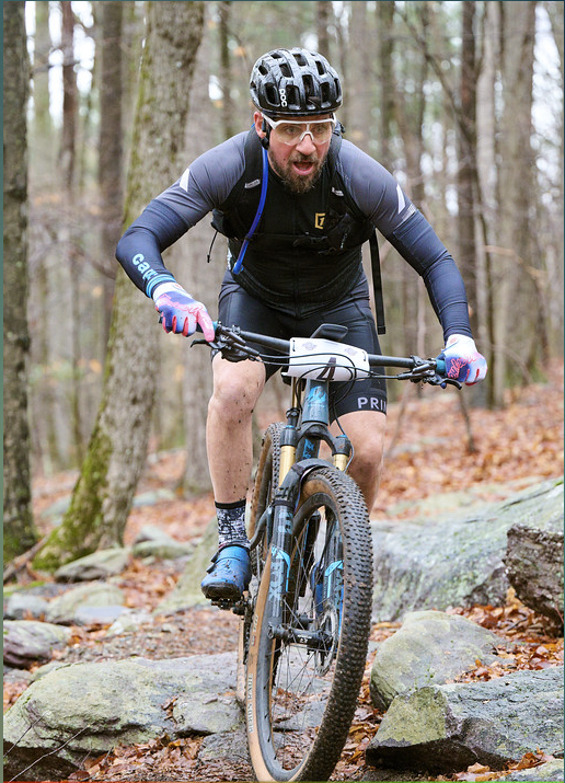 Mountain biker climbing rocky singletrack at Jungle Habitat