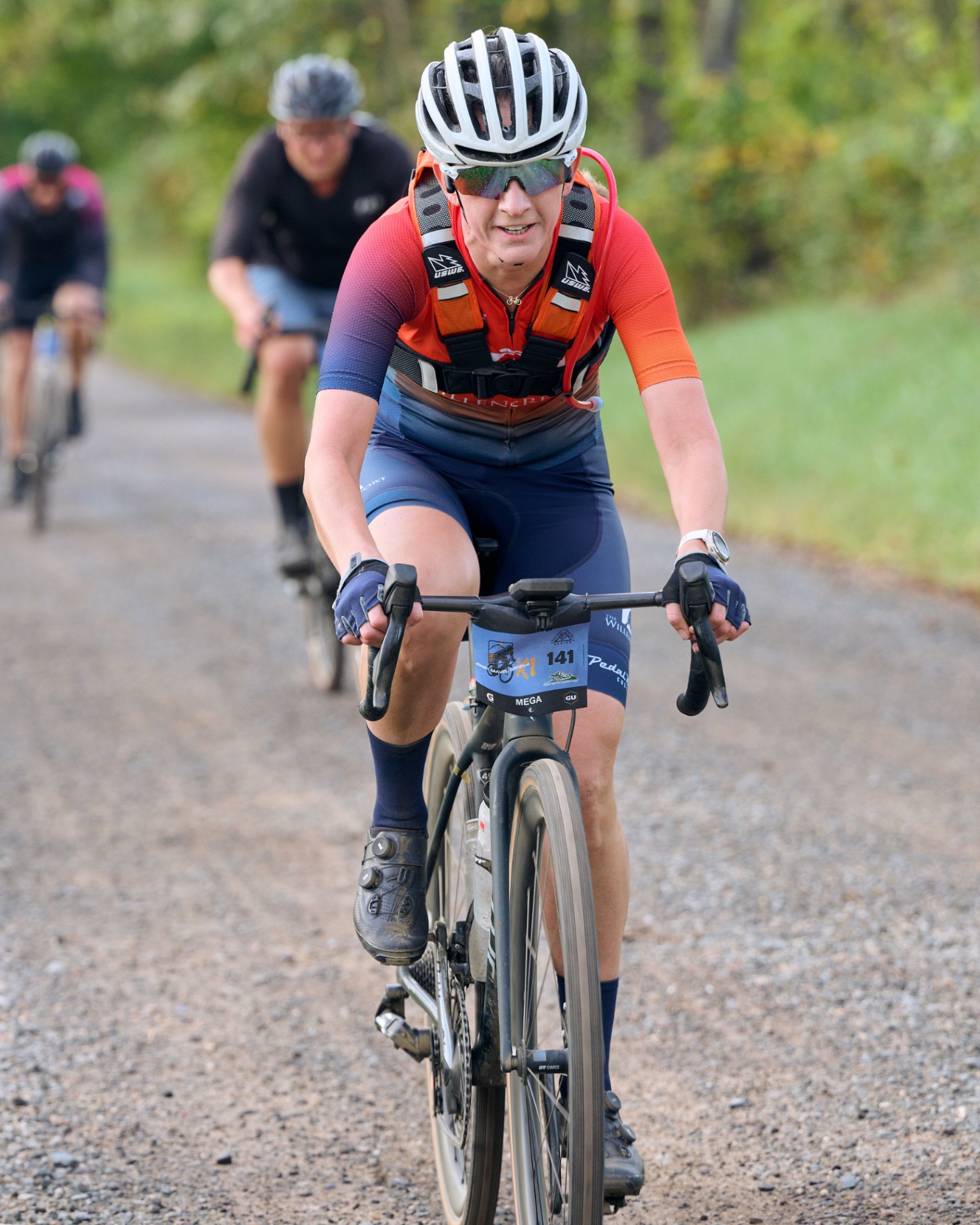 Mega rider pushing the pace on a gravel road