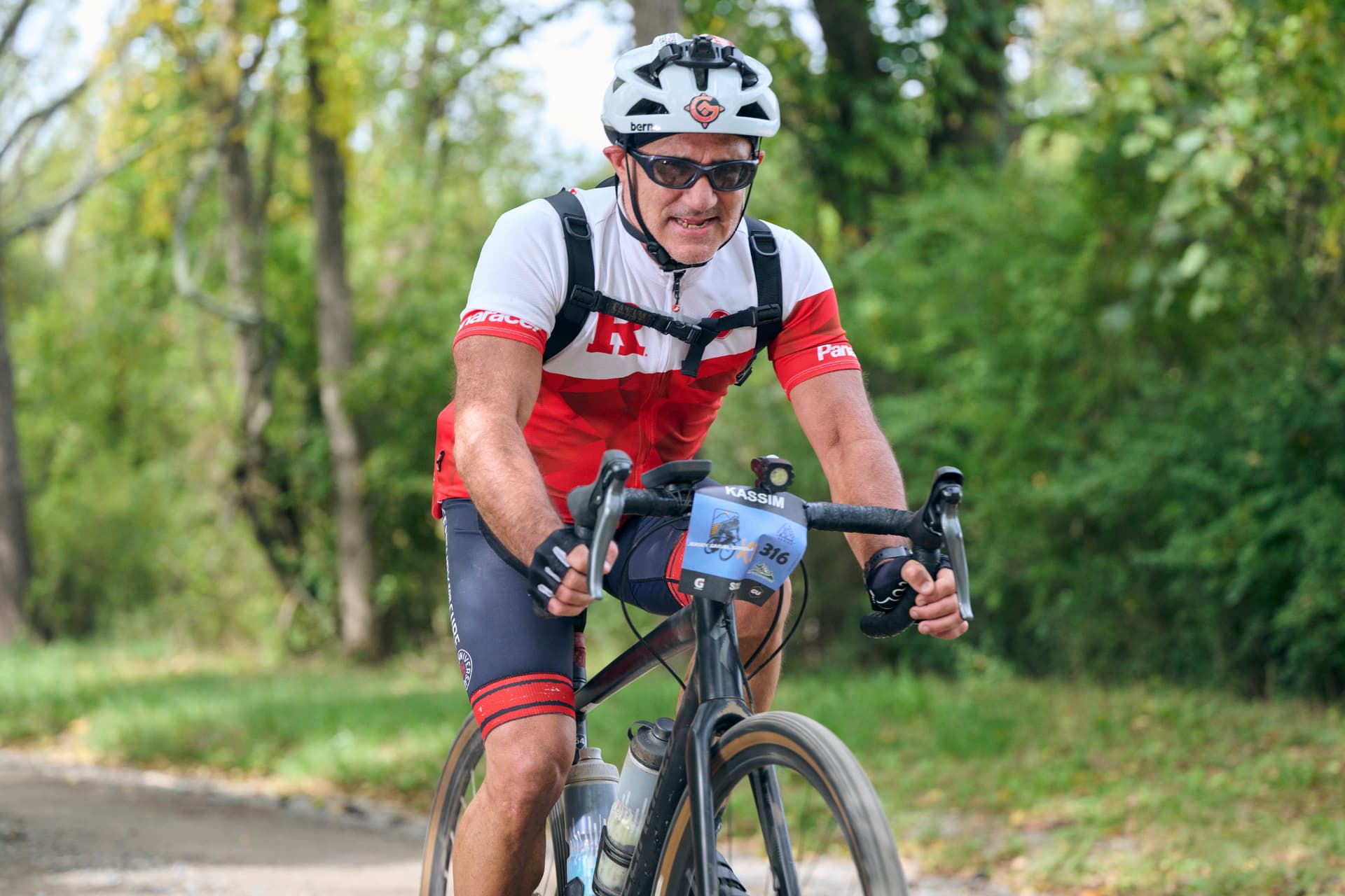 Rider with race number 316 grinding through the woods